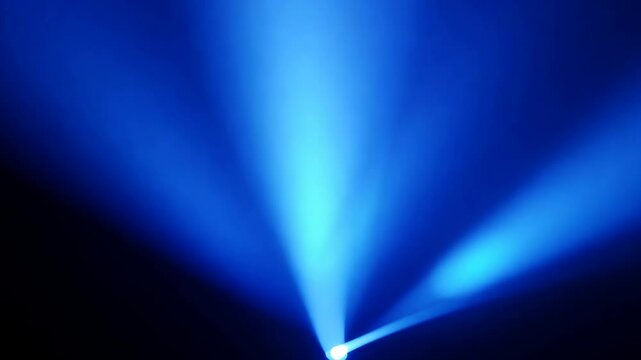 Blue rays of light on a black background