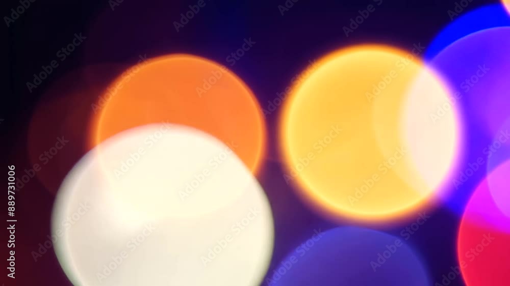 Poster Vibrant looping bokeh background with dynamic multi-colored lights.