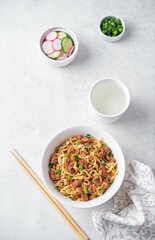 Ground meat spicy ramen noodles in a bowl