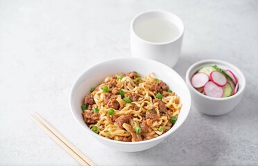 Ground meat spicy ramen noodles in a bowl