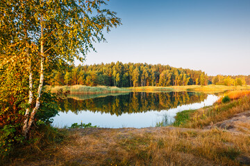 A calm and silent morning at a small lake. Location place Small Polissya, Ukraine, Europe. Beauty of earth.