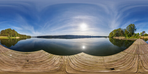 full seamless spherical hdri 360 panorama on wooden pier of lake or river in morning or sunset in...