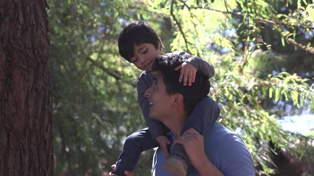 Father's Day, Mexican father with his son playing outdoors