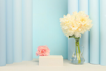Stage for demonstrating product and business concept. Minimal contemporary aesthetic, Premium empty podium. Beautiful floral arrangement with peony flowers, elegant beauty concept,
