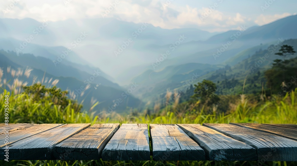 Poster wooden tabletop with a blurred background of mountains and grass fields concept of freshness and rel