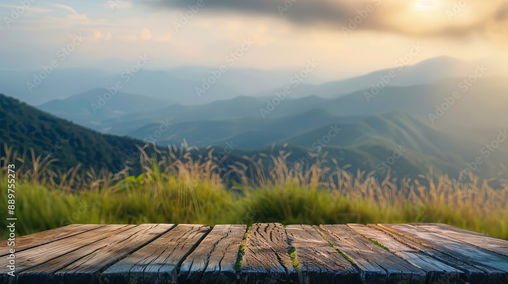 Poster wooden tabletop with a blurred background of mountains and grass fields concept of freshness and rel