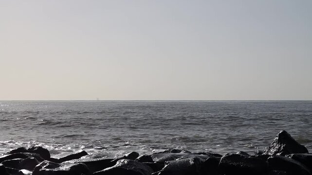 Waves on a rocky beach. Ocean coastline. Stop motion moving image clip mp4. Santa Severa Italy