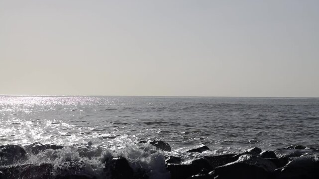 Waves on a rocky beach. Ocean coastline. Stop motion moving image clip mp4. Santa Severa Italy