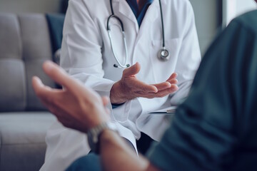 Doctor and patient in conversation with focus on hand gestures. Concept for healthcare, communication, and medical consultation