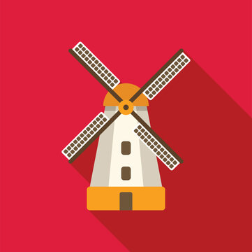 Traditional dutch windmill with rotating blades is producing energy on a red background