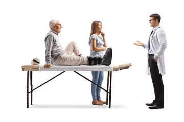 Obraz premium Doctor talking to an injured elderly man and young woman