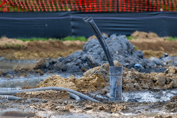 Casing pipe with polyethylene ground loop pipes in the process of being installed in a new...