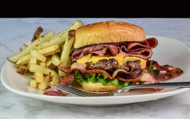roast beef and bacon on a cheese burger