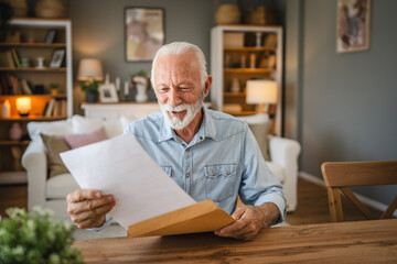 Senior man read a letter document from envelope whit good news