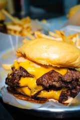 close up of a triple cheese burger