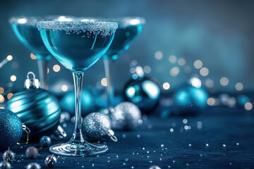 festive blue cocktails with silver glitter rims and Christmas decorations