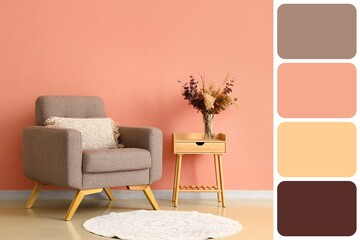 Vase with dry floral decor on wooden table and grey armchair near peach wall. Different color patterns