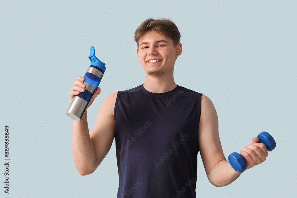 Poster sporty young man with bottle of water and dumbbell on light background