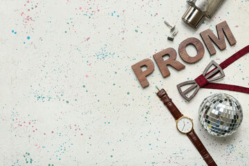 Word PROM with disco ball, wristwatch and bow tie on light grunge background