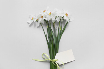 Bouquet of beautiful daffodil flowers on grey background