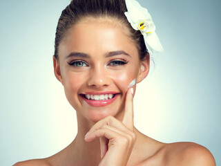Studio, portrait and girl with cream for skincare, anti aging and rich mineral of magnesium for...