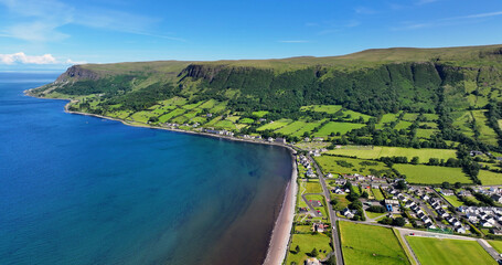 Aerial View of Glenariff Glen at Waterfoot Village on the Irish Sea Co Antrim Northern Ireland on a sunny day with a blue sky.