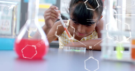 Conducting science experiment, child with beakers and test tubes, image over