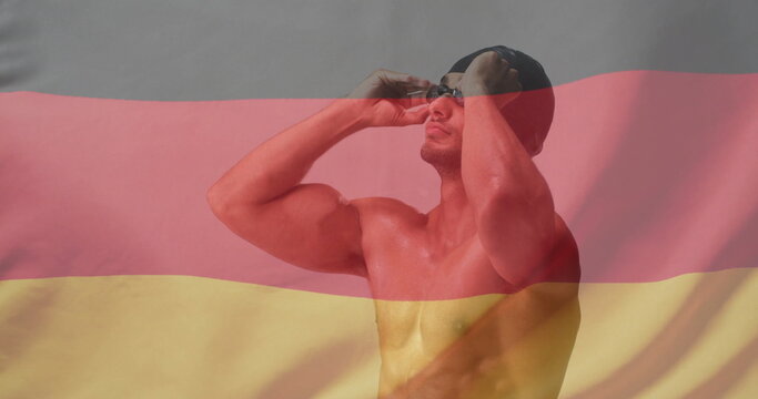 Image of flag of germany over caucasian male swimmer