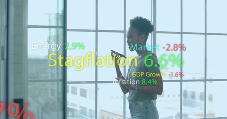 Image of financial data processing over african american businesswoman in office