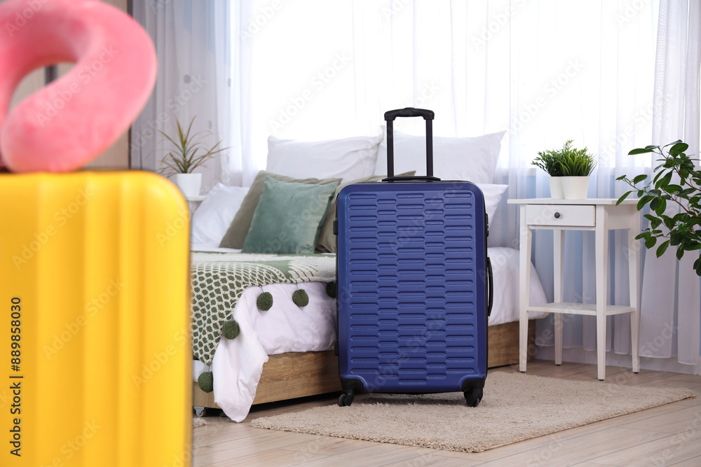 Sticker Packed suitcase near bed in bedroom