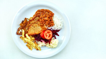 Traditional brazilian meal known as  prato feito on the white background with copy space.
