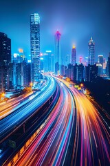 Fototapeta premium Long exposure captures the vibrant light trails of traffic on a modern data highway, symbolizing speed and the flow of information