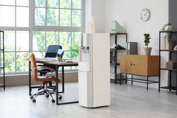 Interior of modern office with workplace and water cooler