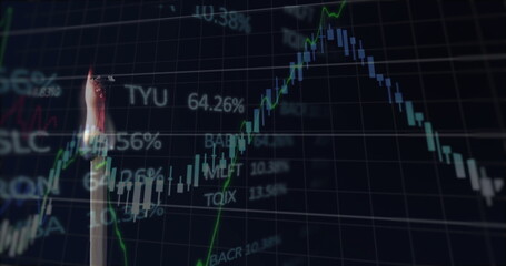 Image of financial data processing over lit match