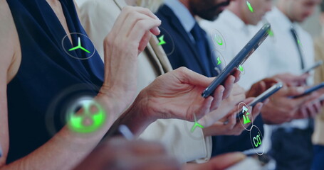 Image of ecology icons over diverse colleagues using smartphones in office