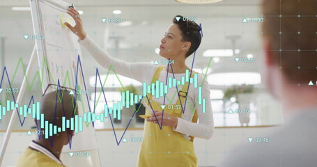 Image of graph processing data over biracial casual businesswoman presenting at office meeting