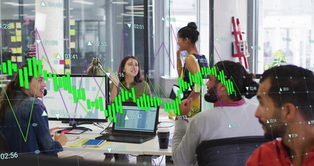 Image of green graph processing data over diverse colleagues high fiving at casual office