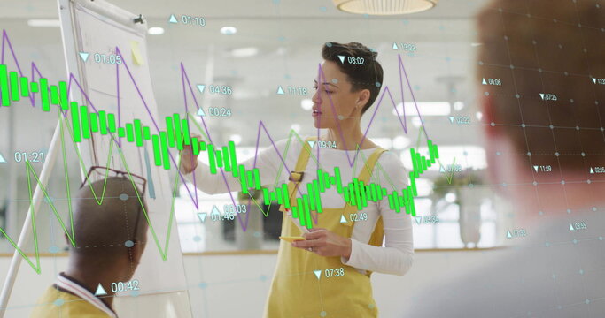 Image of graph processing data over biracial casual businesswoman presenting at office meeting