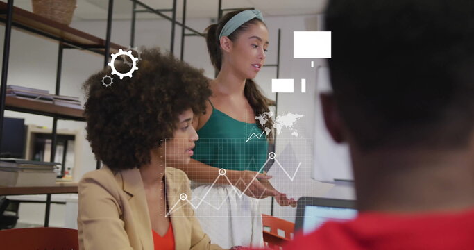 Image of media and data icons over diverse female colleagues at casual office meeting