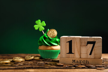 Composition with block calendar on wooden table. St. Patrick's Day celebration