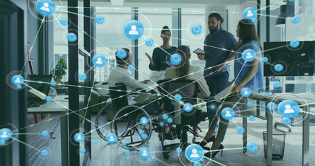 Image of network of connections with icons over disabled and diverse colleagues at meeting