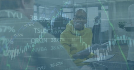 Image of data processing over happy diverse male colleagues talking at casual office