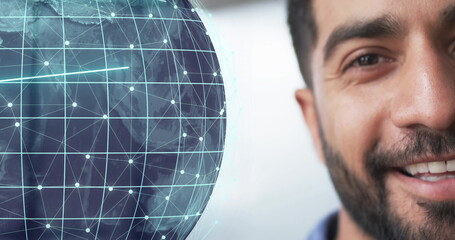 Image of globe and data processing over biracial businessman in office