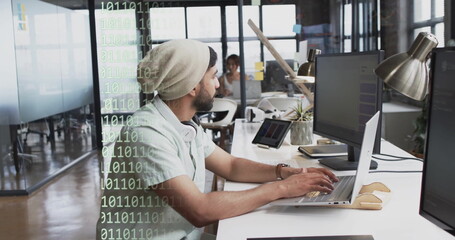 Image of binary coding and data processing over biracial businessman in office