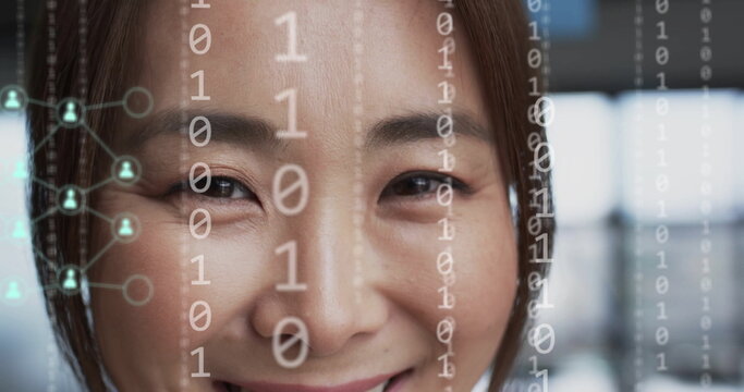 Image of digital icons, binary coding data processing over asian businesswoman in office - Powered by Adobe