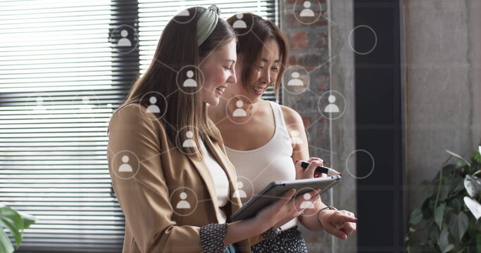 Image of digital icons and data processing over diverse business people in office