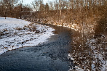 Creek in winter with snow and trees