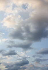 Fototapeta premium It's a blue sky with atmospheric puffy clouds.