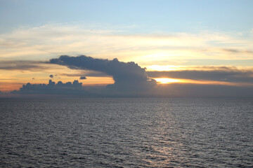 Fototapeta premium View Of Sunset Through Clouds In The Sea 