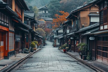 Fototapeta premium An empty street in the center of the frame, surrounded by traditional japanese houses